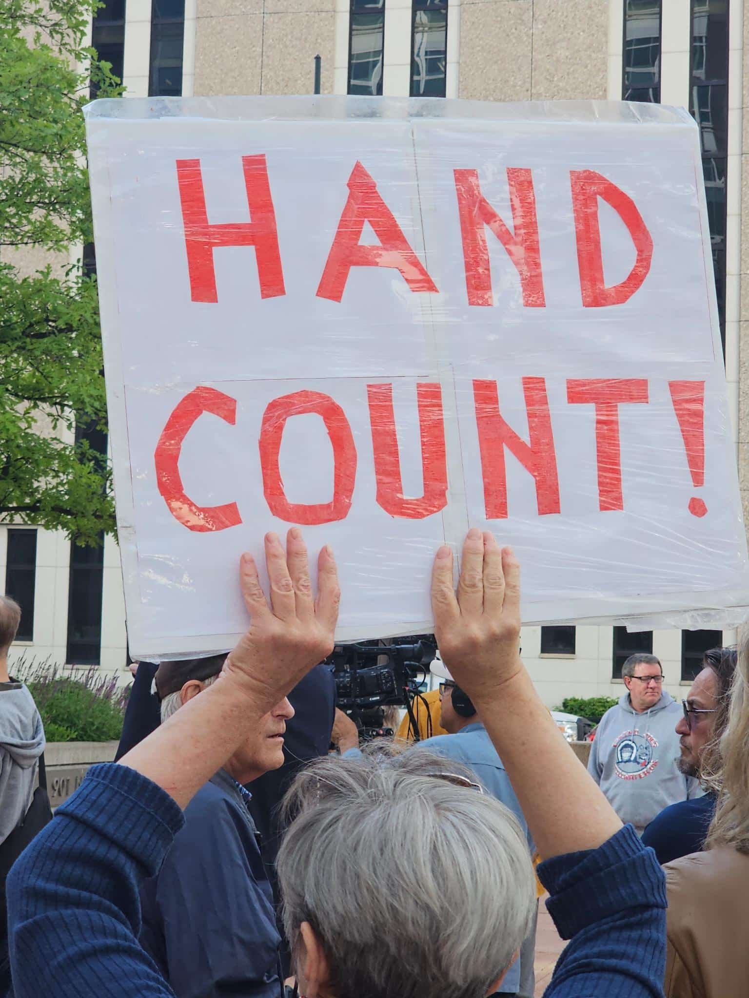 hand count sign outside Colorado courthouse