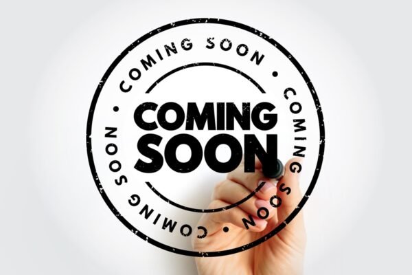 Coming Soon with hand and marker