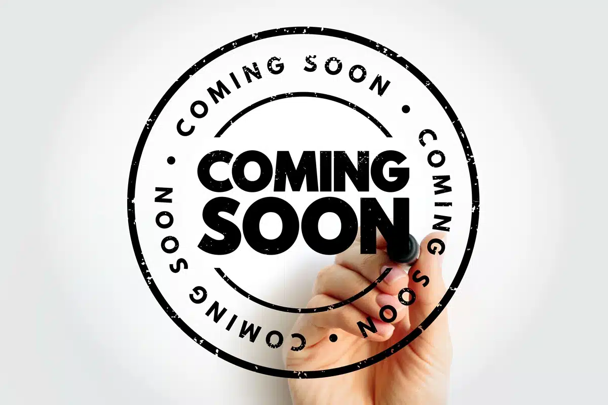 Coming Soon Hand and Pen Coming Soon with hand and marker